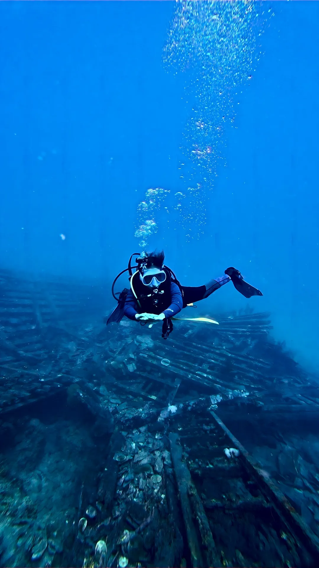 Diver exploring a shipwreck in Karimunjawa